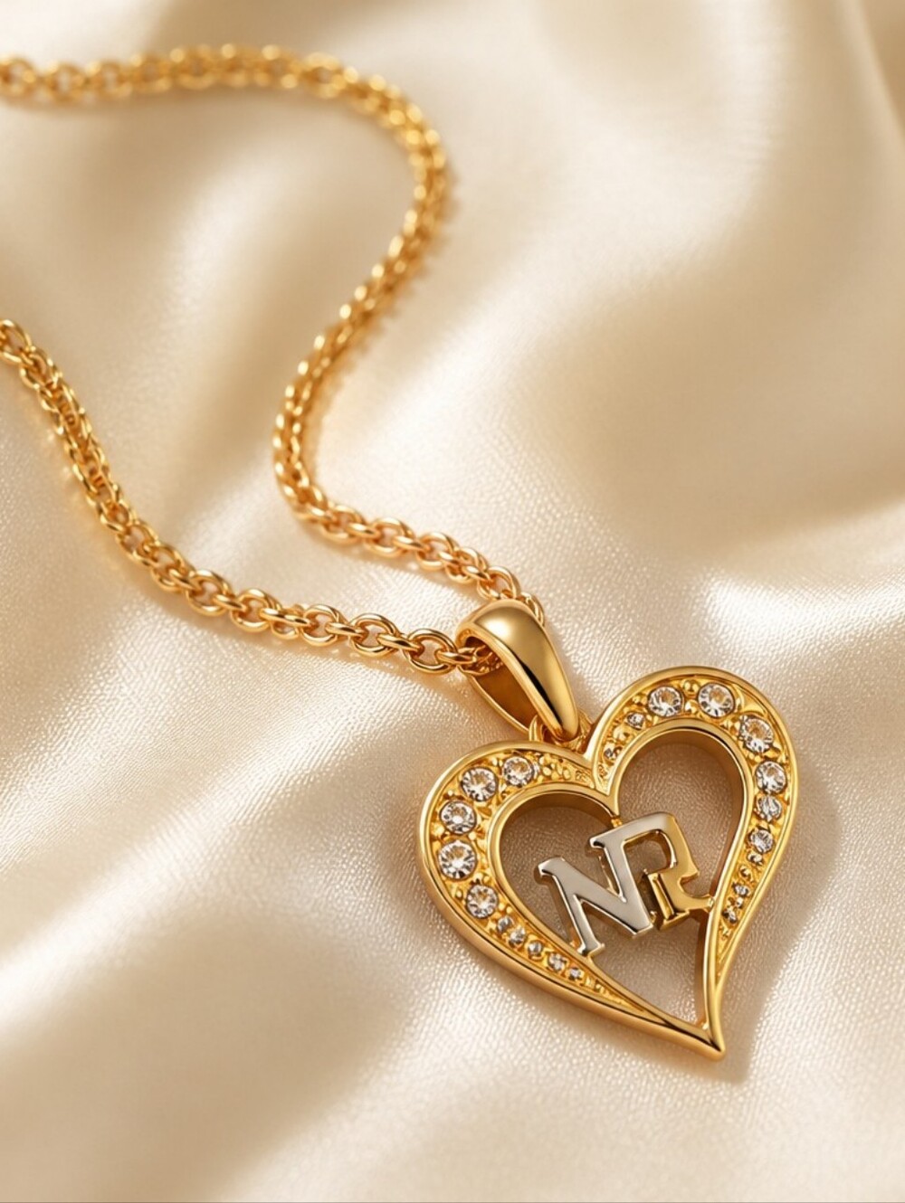 Nina Ricci Gold Heart Pendant Necklace with Clear Stones